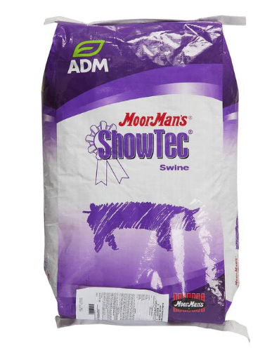 Bag of MoorMan's ShowTec Swine feed with ADM branding on a white background