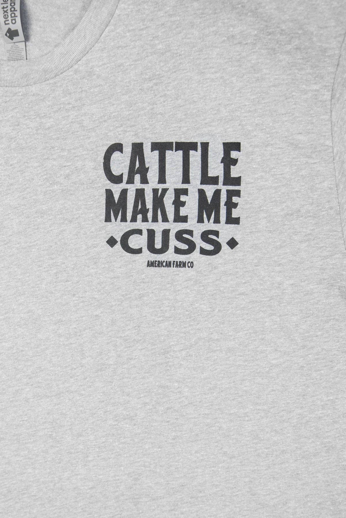 Gray t-shirt with black text 'CATTLE MAKE ME CUSS' on a plain background