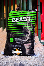 Lindner Beast product packaging on a concrete surface with a red door in the background