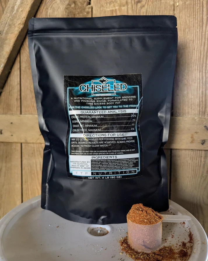 Black bag of Chiseled on a wooden background