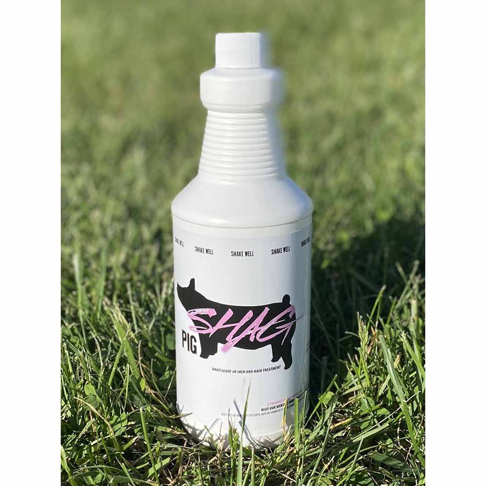 Bottle of Pig Shag sitting in grass