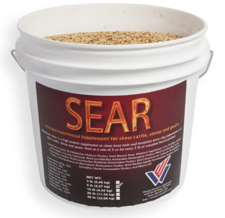 Bucket of SEAR protein nutritional supplement for animals with a visible label.