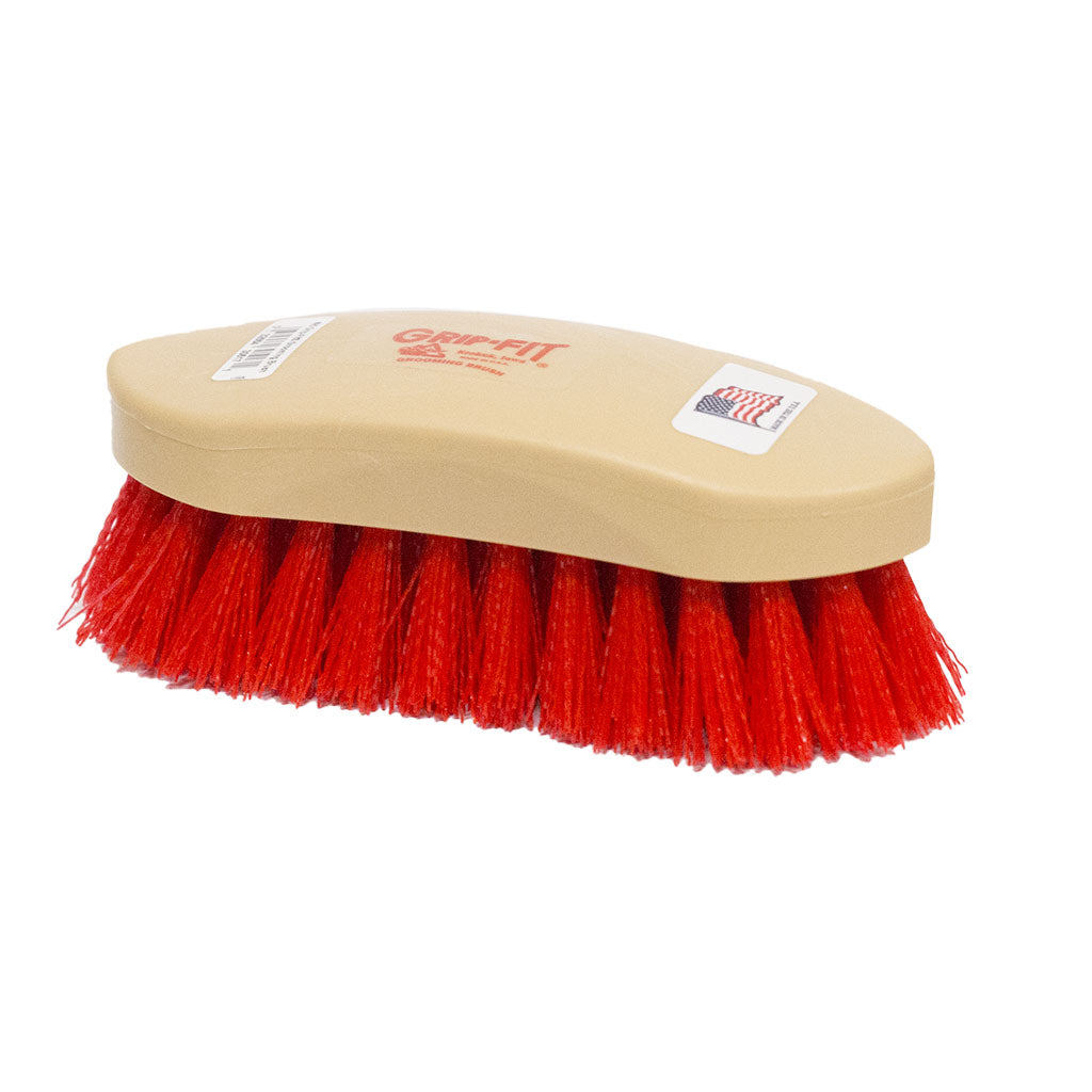 Beige brush with red bristles on a white background