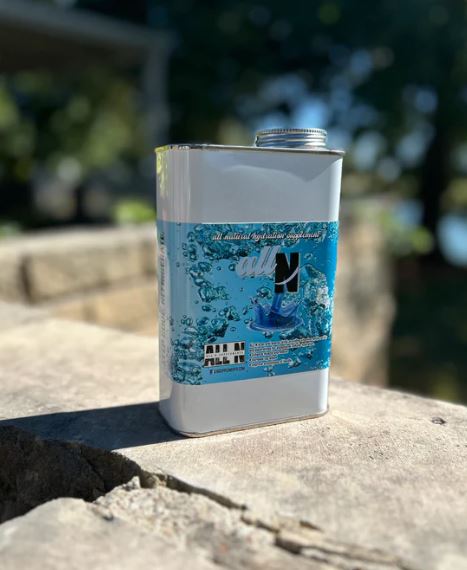 Can of All N with blue label on a stone surface outdoors