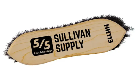 Wooden brush with black bristles and 'Sullivan Supply' branding on a white background