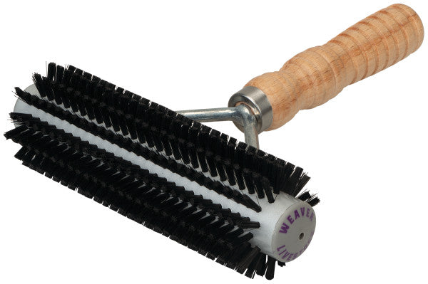 Pet grooming brush with black bristles and a wooden handle on a white background