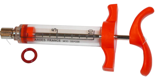 Syringe with red plunger and clear barrel on a white background