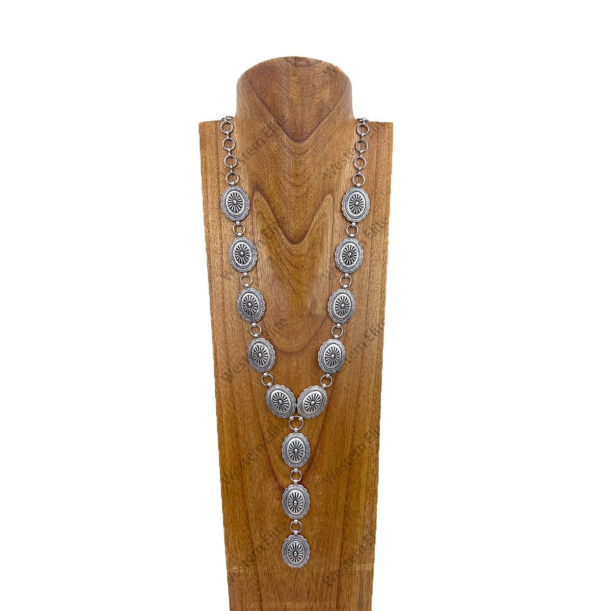 Silver necklace on a wooden mannequin against a white background