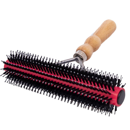 Red and black round brush with wooden handle on a white background