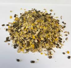 Heap of dried herbs on a white background