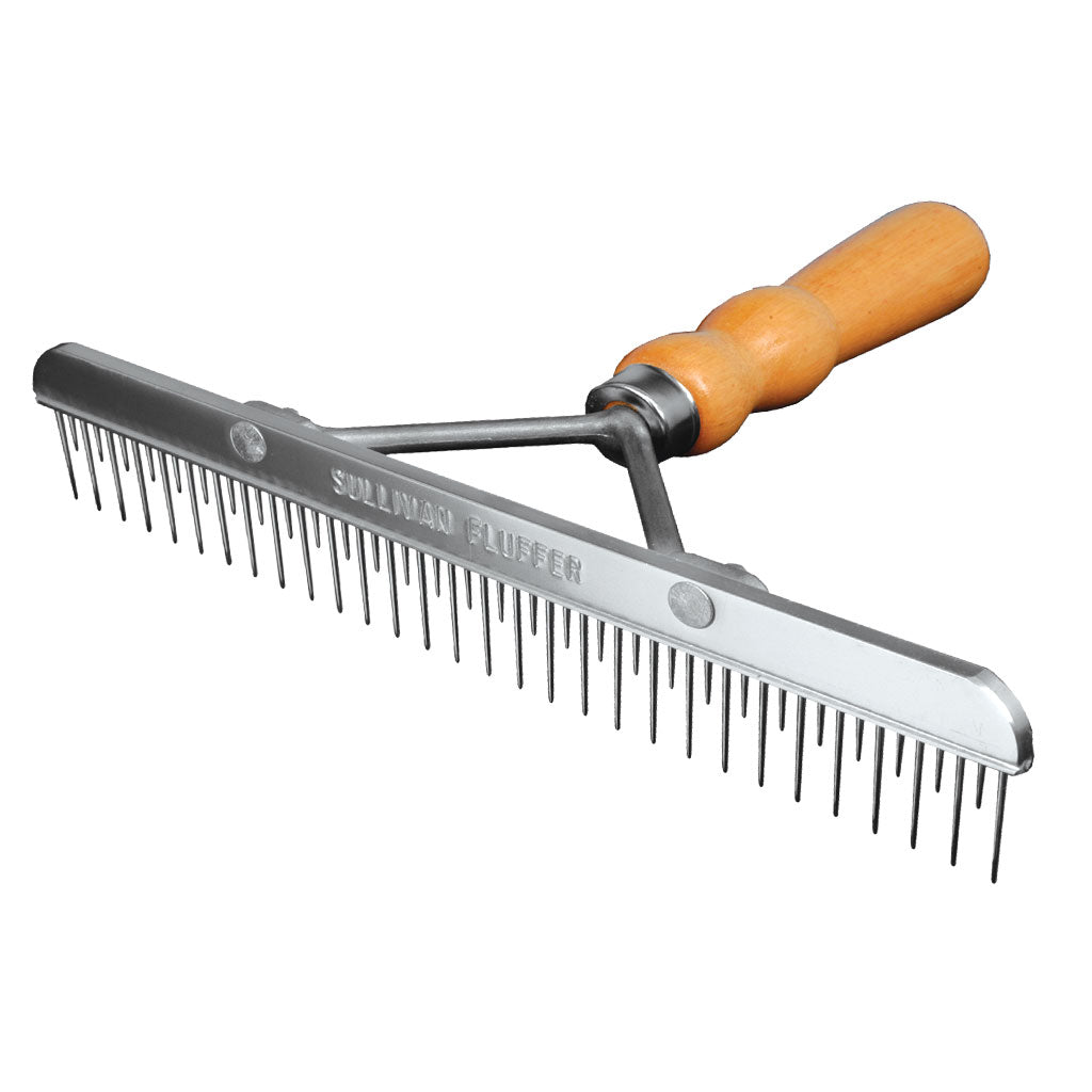 Metal comb with wooden handle on a white background