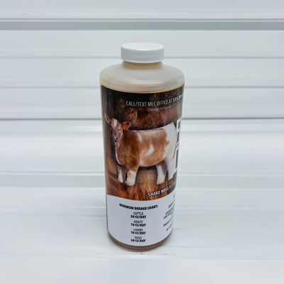 Bottle with a label featuring an image of a goat on a white background