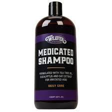 Bottle of Weaver Medicated Shampoo on a white background