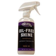Spray bottle labeled 'Oil-Free Shine' on a white background