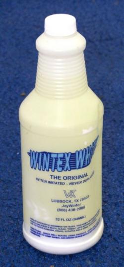 White bottle of Wintex White on a blue background