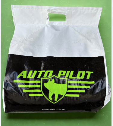 White and black bag with green 'Auto Pilot' logo on a green background