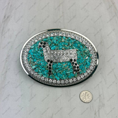 Belt buckle with turquoise stone and silver accents on a light gray background
