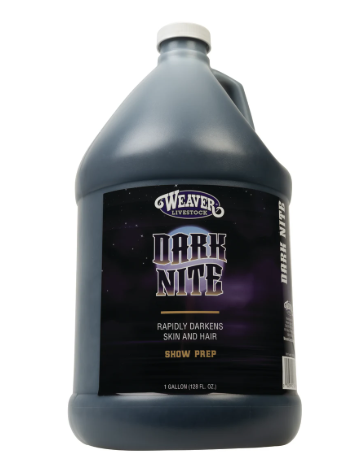 A large plastic jug of Weaver Livestock 'Dark Nite' show prep, featuring a dark purple label with a white cap, isolated on a white background.
