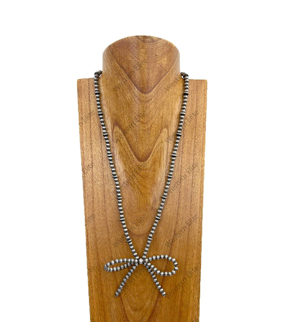 Necklace with metal beads on a wooden mannequin