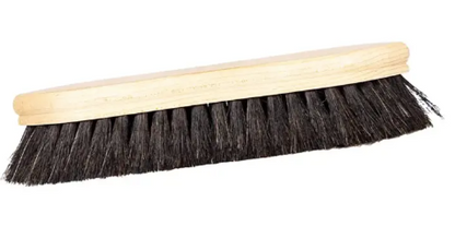 Brush with black bristles and wooden handle on a white background