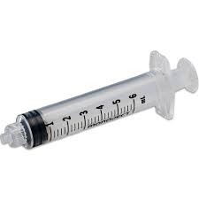 Medical syringe with measurement markings on a white background